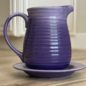 Decorative water pitcher with drip plate . Beautiful purple lavender color